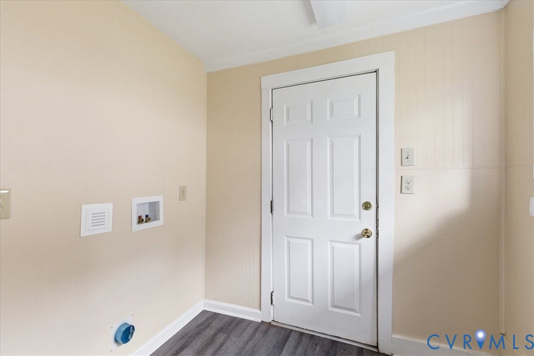 100 N 3rd Avenue, Hopewell, VA 23860 Utility area featuring wood-finish flooring, a six-panel exterior door, and built-in plumbing hookups