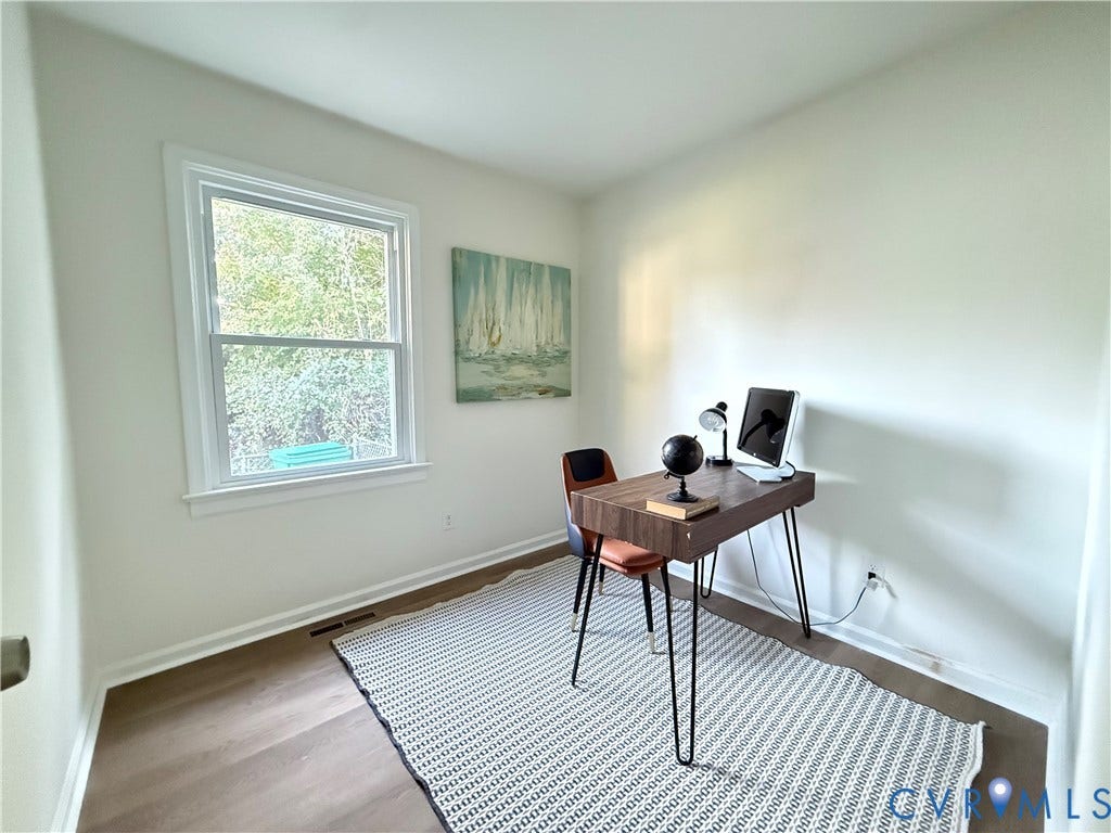 120 N New Avenue, Henrico, VA 23075 Neutral-toned walls, wood-finish flooring, and a single-hung window with white casing