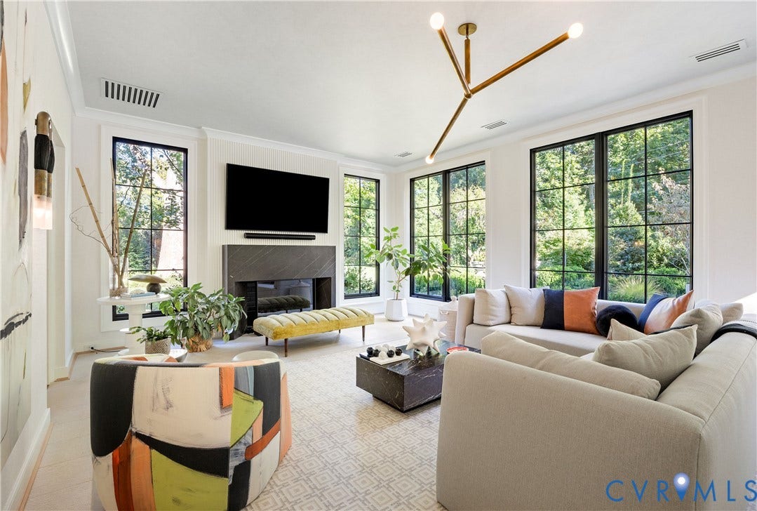 301 Lock Lane, Windsor Farms, Richmond, VA 23226 Family room with heated limestone floors, all new windows and its own HVAC, centered on a slatted fireplace wall with a custom marble mantel.