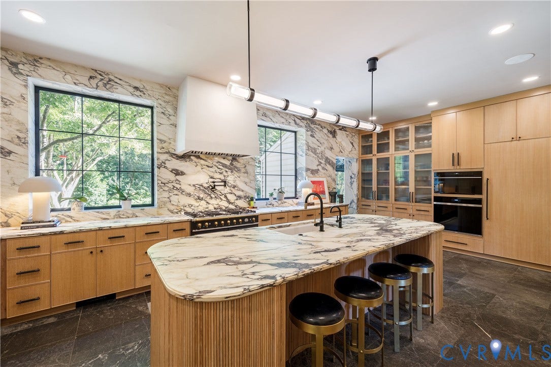 301 Lock Lane, Windsor Farms, Richmond, VA 23226 The striking kitchen wrapped in Calacatta Viola marble with a hand-reeded white oak island.