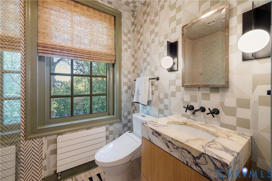 301 Lock Lane, Windsor Farms, Richmond, VA 23226 En suite bath with a frameless glass shower, white oak vanity and Calacatta Viola top.