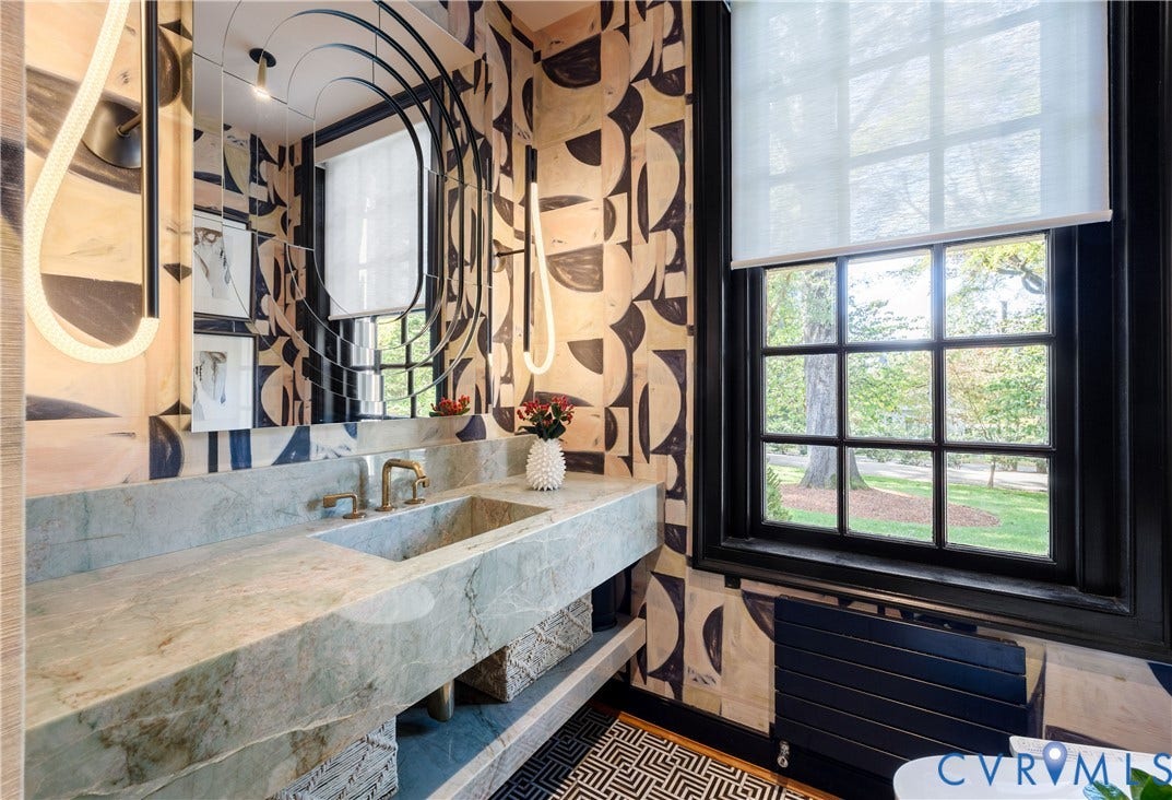301 Lock Lane, Windsor Farms, Richmond, VA 23226 Powder room with a custom wall-to-wall integrated stone sink, Luke Lamp Co. lighting and Lindsay Cowles grasscloth.