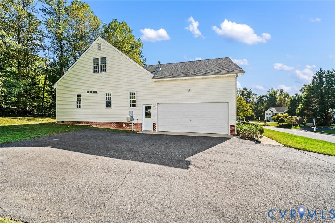 Paved Driveway and Side Entry 2 Car Garage