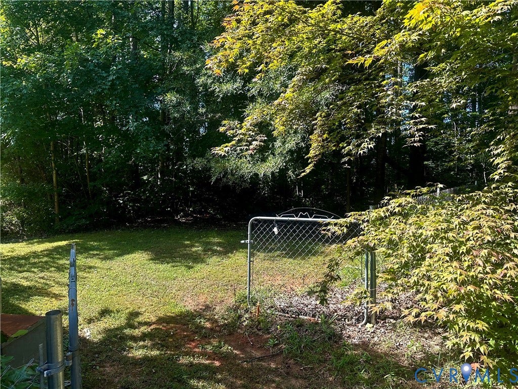 25400 SAYLERS CREEK ROAD, Deatonville, Jetersville, VA 23083 Fenced backyard featuring established trees and perimeter vegetation