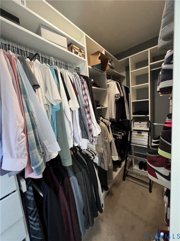 2310 Liesfeld Parkway, West Broad Village, Henrico, VA 23060 Walk-in closet featuring floor-to-ceiling white built-in shelving, multiple hanging rods, and integrated storage cubbies