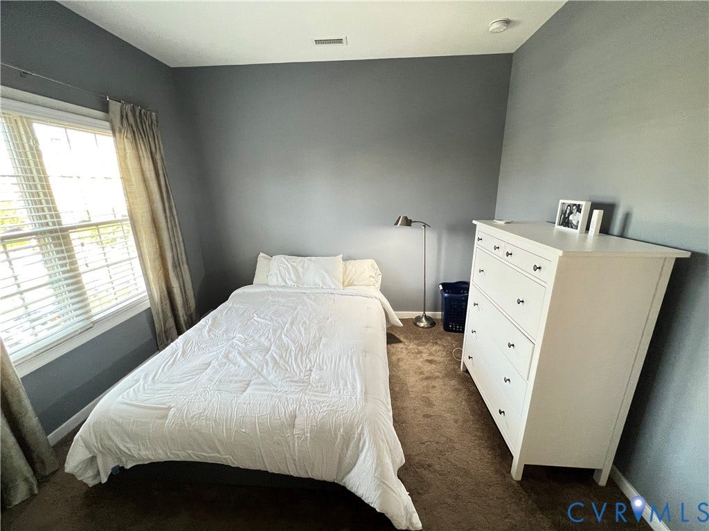 2310 Liesfeld Parkway, West Broad Village, Henrico, VA 23060 Neutral-toned wall paint, plush carpeting, and a multi-pane window with white trim