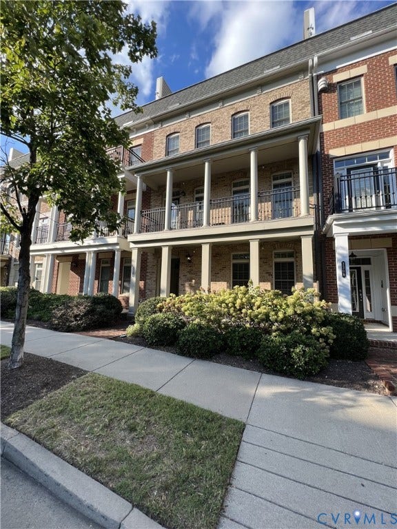 2310 Liesfeld Parkway, West Broad Village, Henrico, VA 23060 Multi-story brick exterior featuring a covered porch with structural columns and a metal-railed balcony