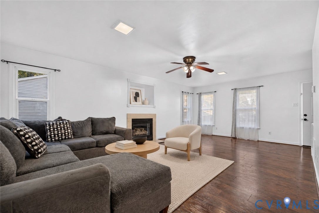 7225 Hartsdale Court, Chesterfield, VA 23832 Virtually-staged Living area featuring wood-finish flooring, a fireplace with a neutral surround, recessed ceiling lighting, and a multi-blade ceiling fan
