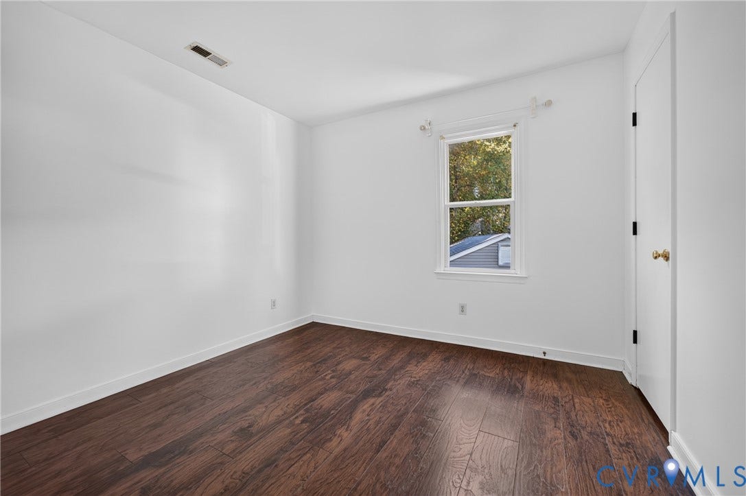 7225 Hartsdale Court, Chesterfield, VA 23832 Virtually Staged Wood-finish flooring, dual windows with decorative trim, and an integrated ceiling fan with multi-bulb light fixture