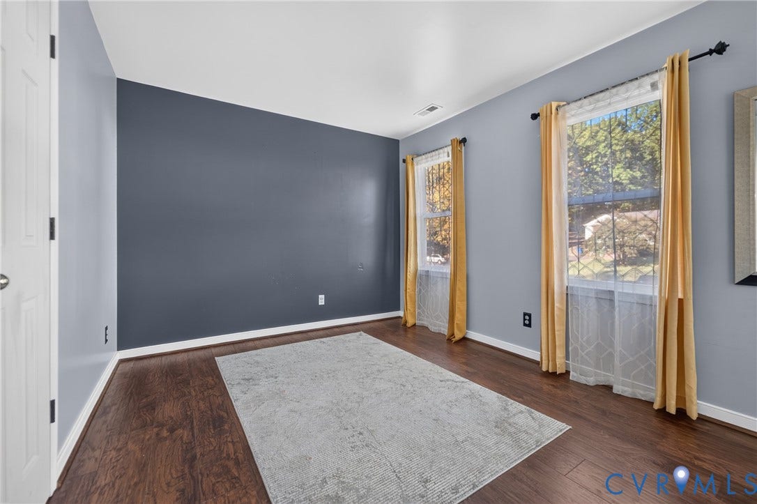 7225 Hartsdale Court, Chesterfield, VA 23832 Virtually staged Bedroom featuring wood-finish flooring, a double-hung window, and a white interior door with brass-toned hardware