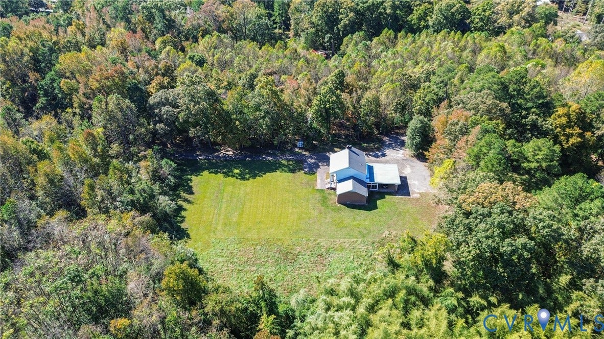13225 Old Happy Hill Road, Chester, VA 23831 Expansive lot featuring a wide open lawn, mature perimeter trees, paved driveway, and detached structure