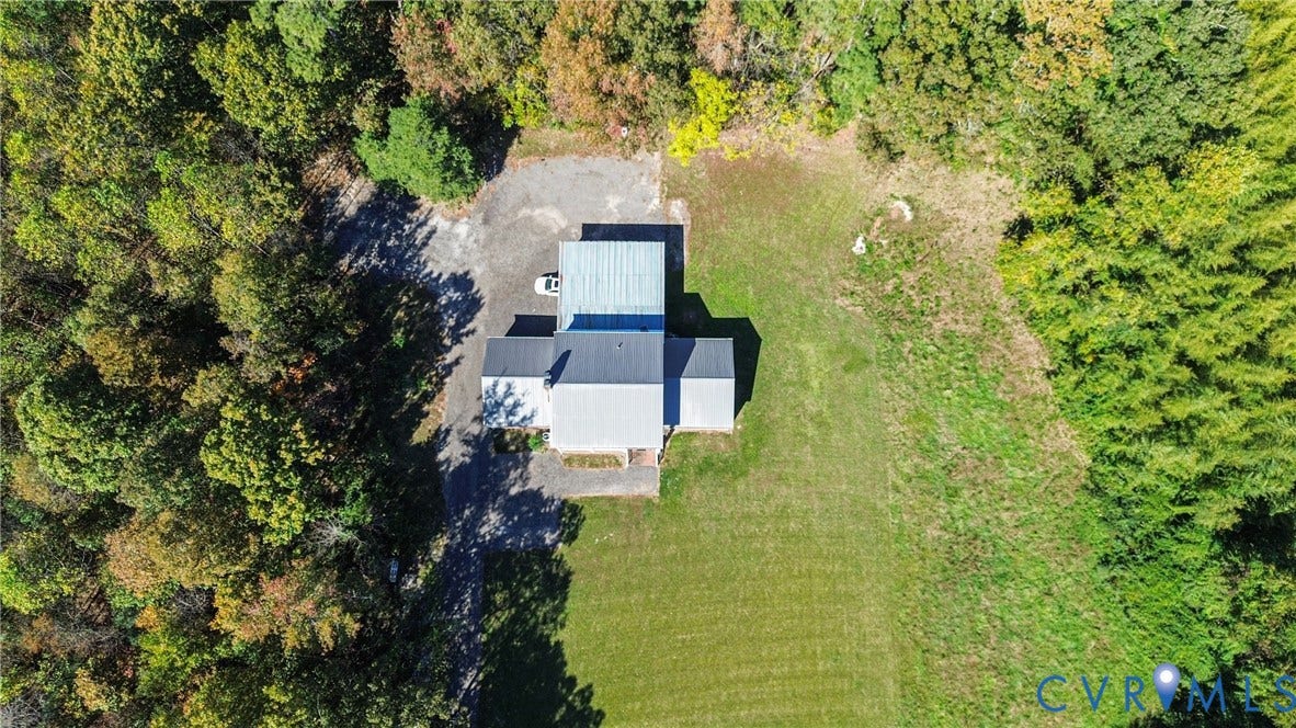 13225 Old Happy Hill Road, Chester, VA 23831 Aerial perspective of a detached structure featuring a metal roof, gravel parking area, and expansive grounds surrounded by mature trees