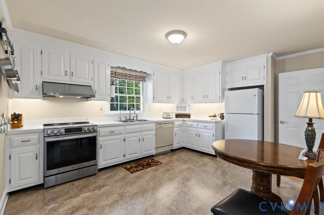 5111 Hurop Road, Sandston, VA 23150 Kitchen featuring white cabinetry, stainless steel range and range hood, neutral solid-surface countertops, and tiled flooring