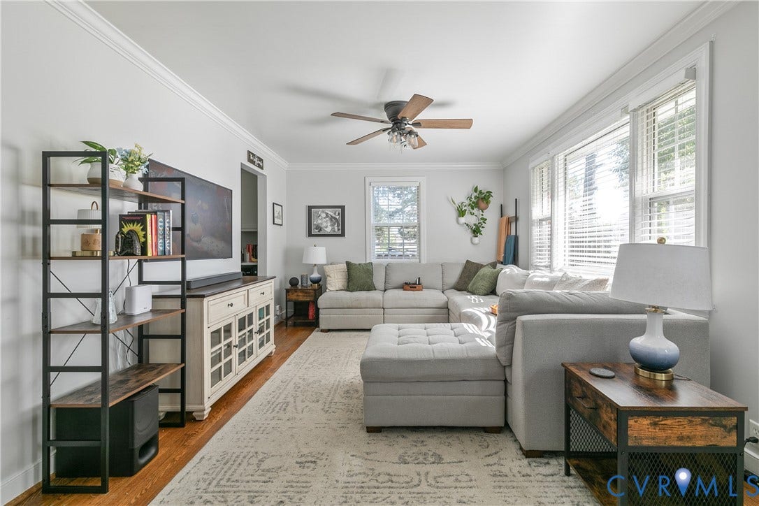 2108 Parkside Avenue, Henrico, VA 23228 Living room featuring wood-finish flooring, crown molding, a central ceiling fan, and multi-pane windows