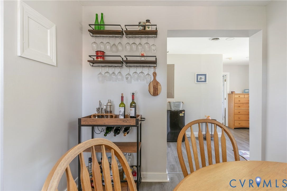 2108 Parkside Avenue, Henrico, VA 23228 Wall-mounted metal and wood-finish shelving with integrated stemware racks and wood-finish flooring