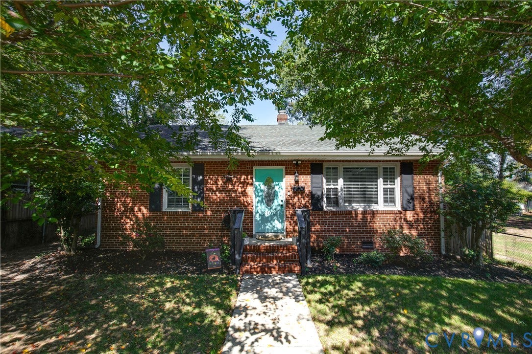 2108 Parkside Avenue, Henrico, VA 23228 Brick exterior featuring decorative black shutters, a gabled roof, and a central entryway with brick steps