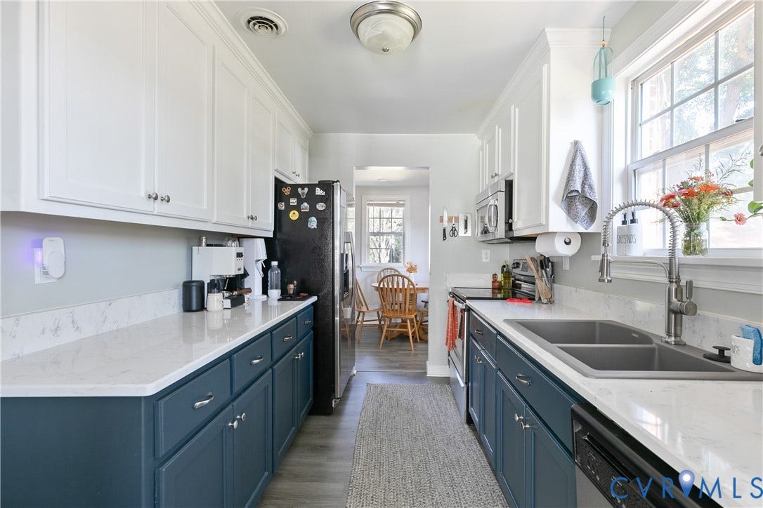 2108 Parkside Avenue, Henrico, VA 23228 Galley kitchen featuring dual-tone cabinetry, quartz countertops, dual-basin undermount sink with arched pull-down faucet, and wood-finish flooring