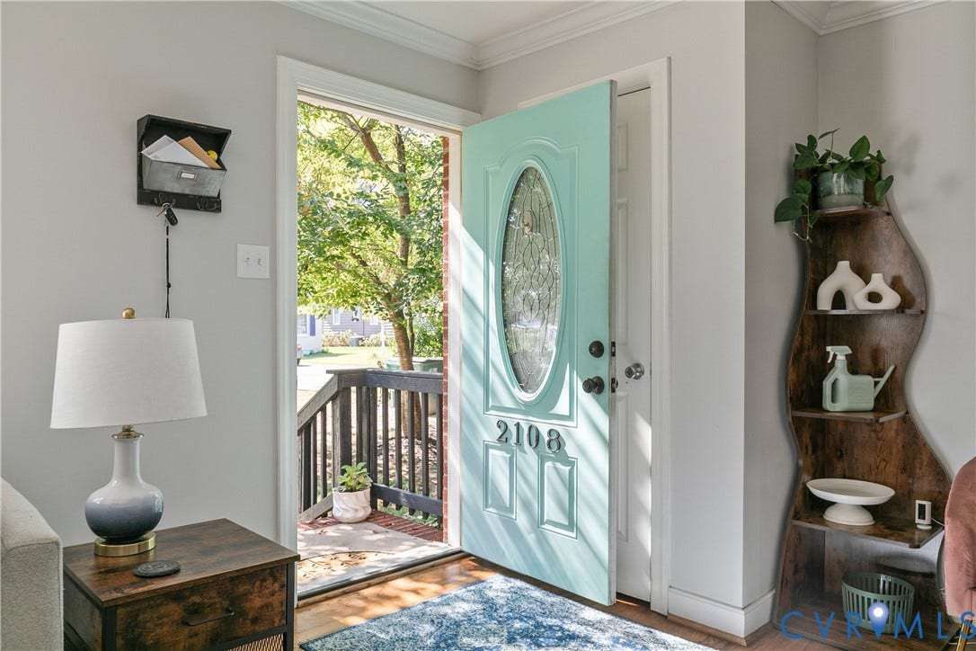 2108 Parkside Avenue, Henrico, VA 23228 Entryway featuring a painted panel door with an oval glass insert, satin-finish hardware, and wood-finish flooring