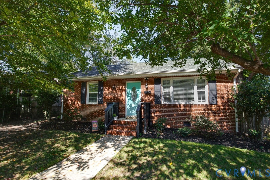 2108 Parkside Avenue, Henrico, VA 23228 Brick exterior featuring dark shutters, a concrete walkway, and an elevated front entrance with railings