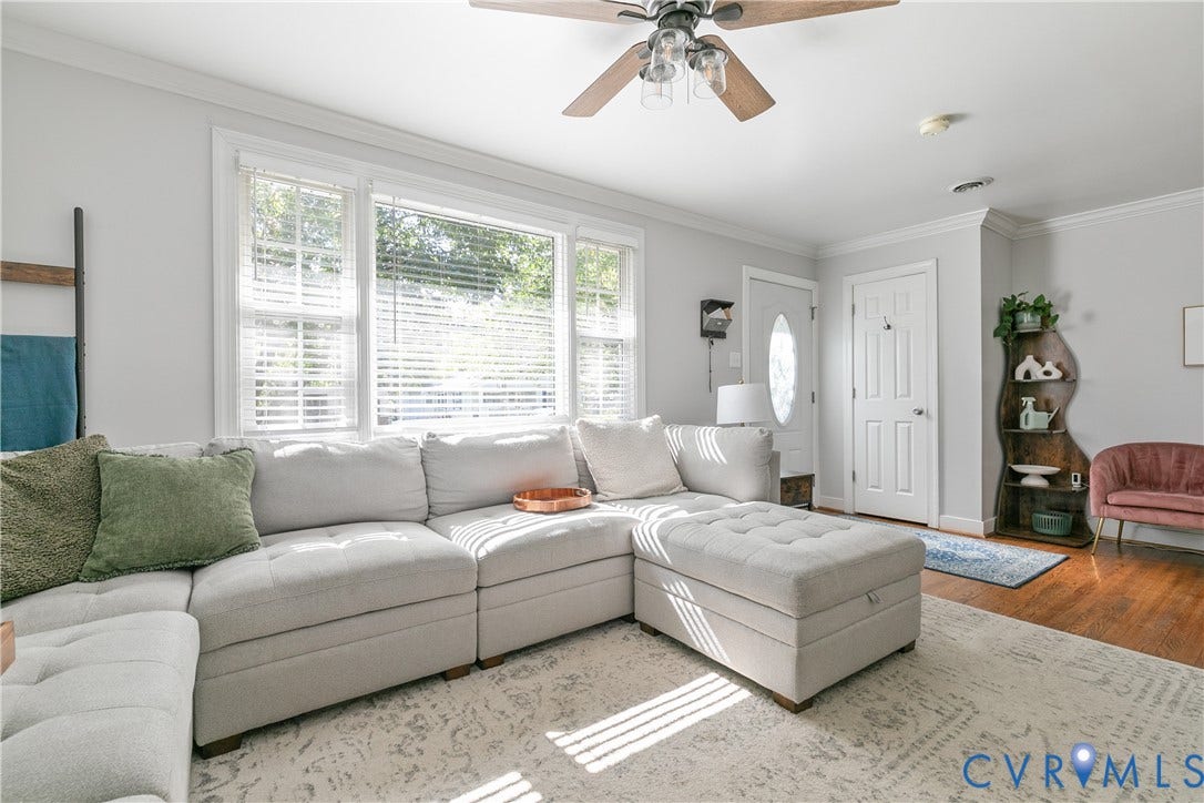 2108 Parkside Avenue, Henrico, VA 23228 Living area featuring crown molding, wood-finish flooring, a multi-pane window with adjustable blinds, and a ceiling fan with integrated lighting