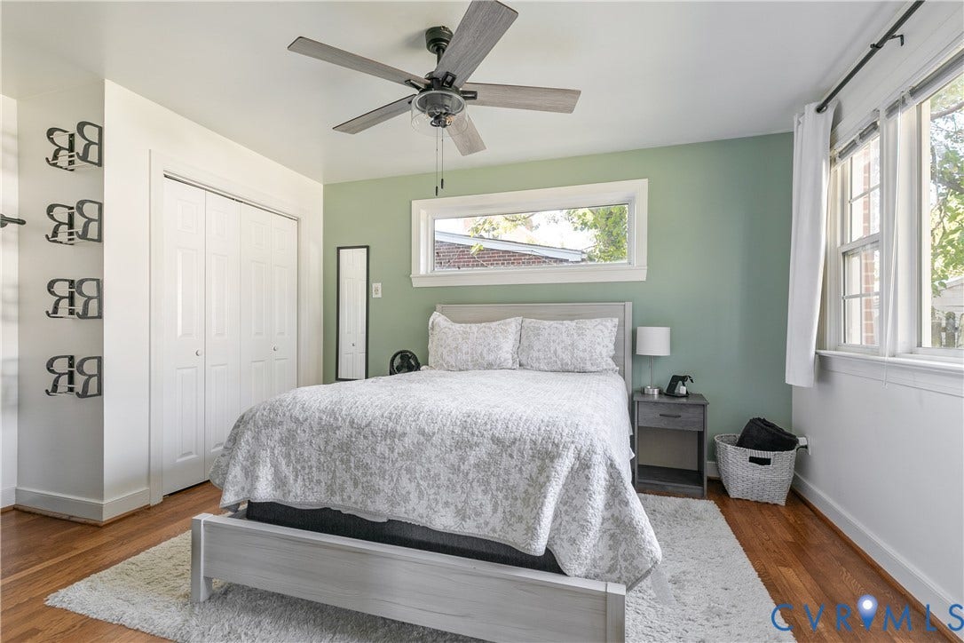 2108 Parkside Avenue, Henrico, VA 23228 Bedroom featuring hardwood flooring, multi-panel bi-fold closet doors, ceiling fan with light fixture, and horizontal window