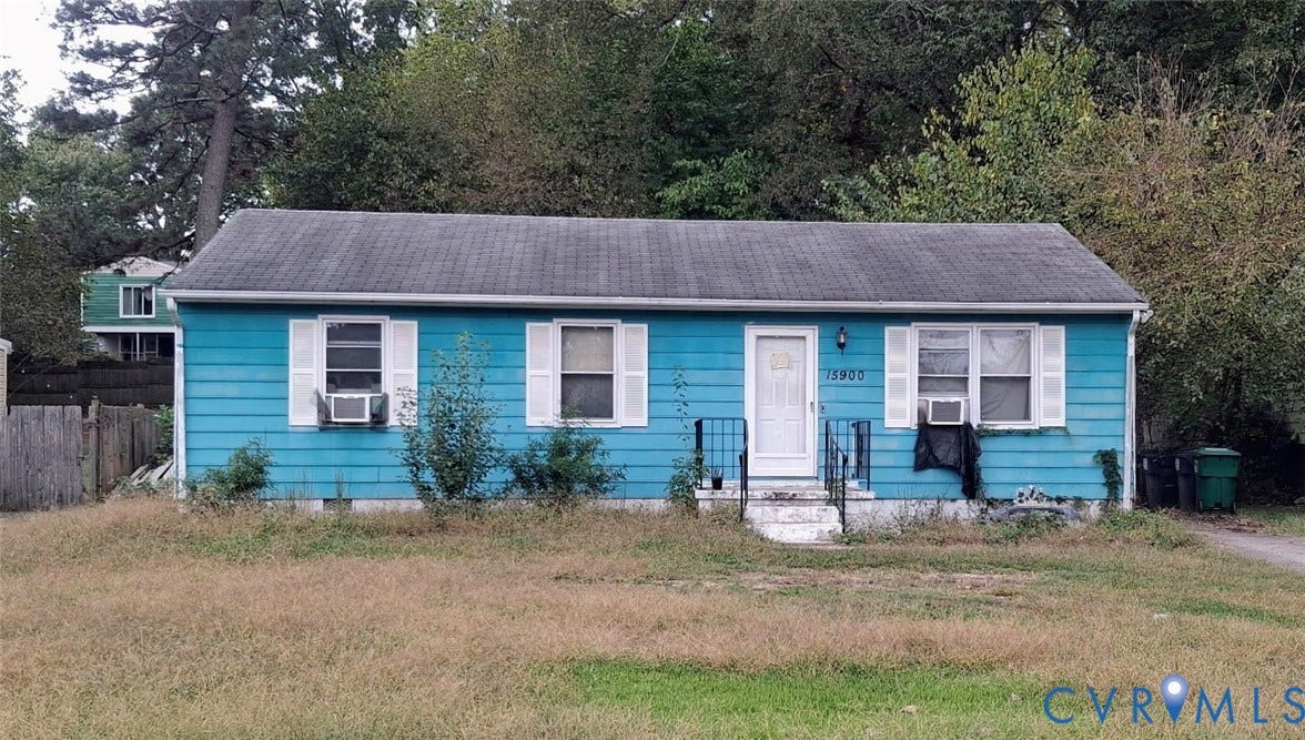 15900 Gary Avenue, Chester, VA 23831 Single-story residence featuring horizontal siding, a gabled roof, white shutters, and an exterior metal railing