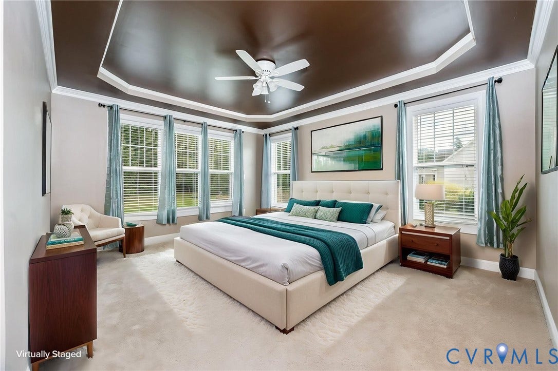 9118 Colonnade Circle, Ashland, VA 23005 Tray ceiling with crown molding, ceiling fan, and carpeted flooring
