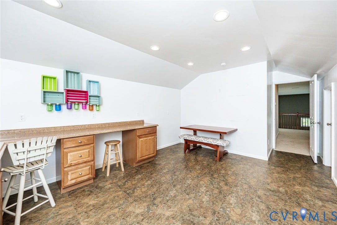 9118 Colonnade Circle, Ashland, VA 23005 Built-in wood cabinetry with stone-finish countertop, recessed lighting, and resilient flooring