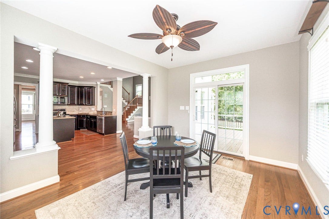 9118 Colonnade Circle, Ashland, VA 23005 Wood-finish flooring, ceiling fan with palm-style blades, decorative columns, recessed lighting, and glass-paneled sliding doors