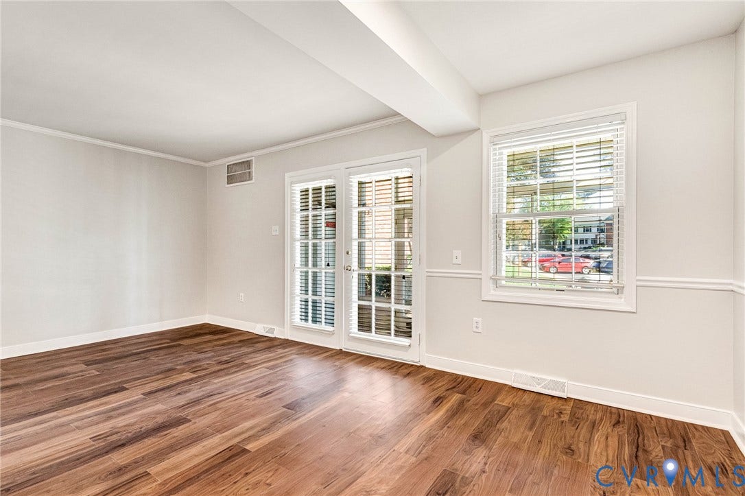 4 Millstone Road, The Hamlet, Henrico, VA 23228 Interior space featuring wood-finish flooring, glass-paneled double doors, a double-hung window, and chair rail molding