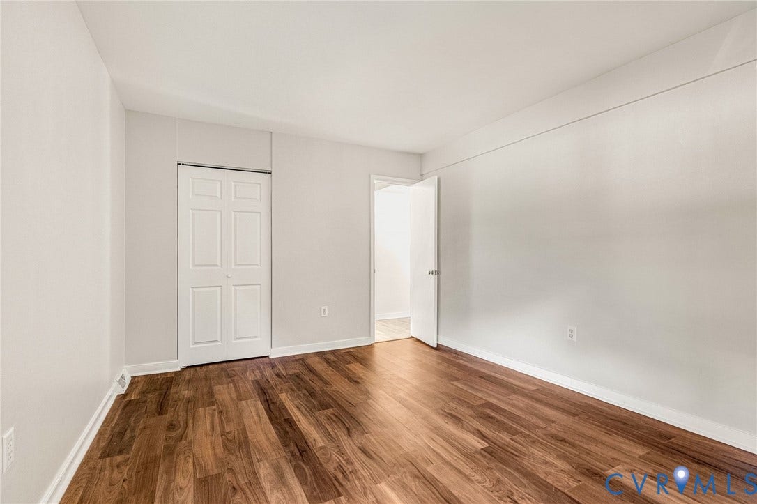 4 Millstone Road, The Hamlet, Henrico, VA 23228 Interior space featuring wood-finish flooring, crisp neutral wall paint, and a two-panel closet door