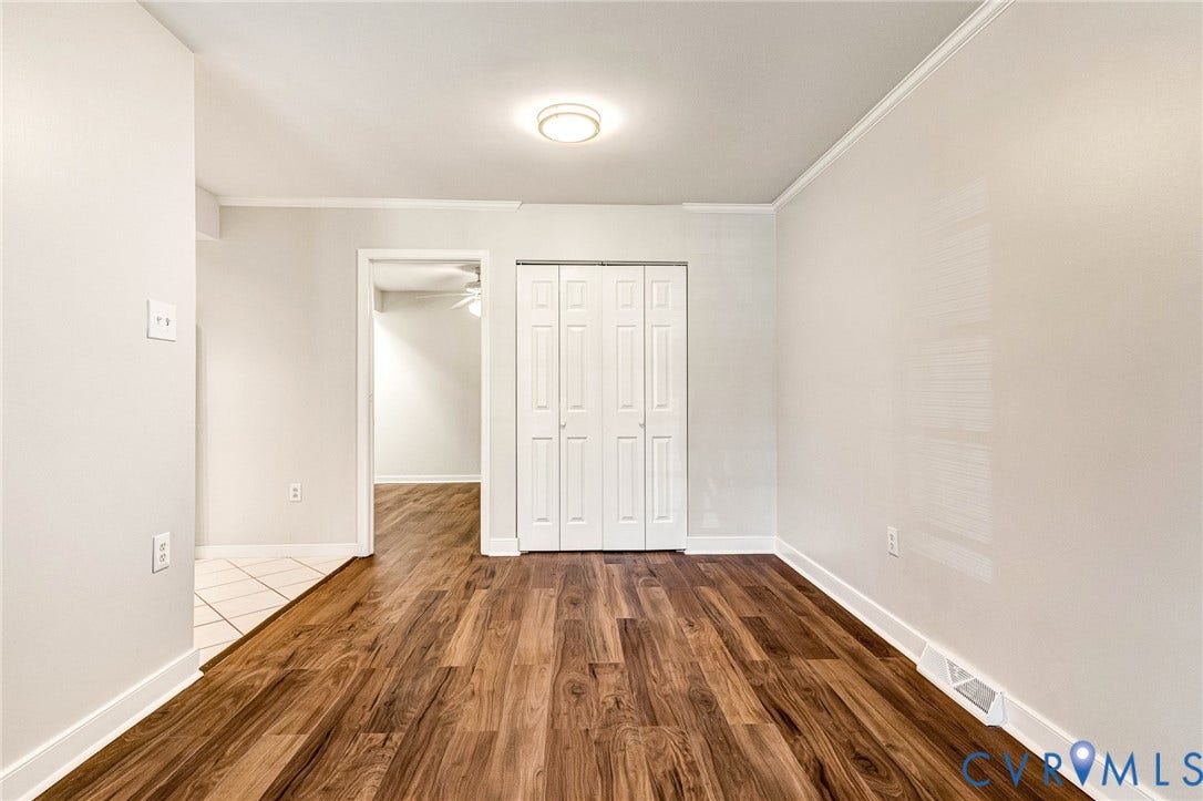 4 Millstone Road, The Hamlet, Henrico, VA 23228 Wood-finish flooring, neutral wall tones, bi-fold closet doors, and flush-mount ceiling lighting