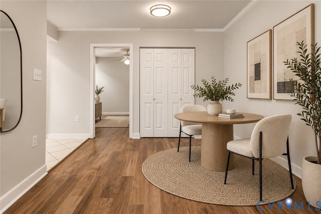 4 Millstone Road, The Hamlet, Henrico, VA 23228 Wood-finish flooring, white bi-fold closet doors, flush-mount ceiling light fixture, and arched wall mirror