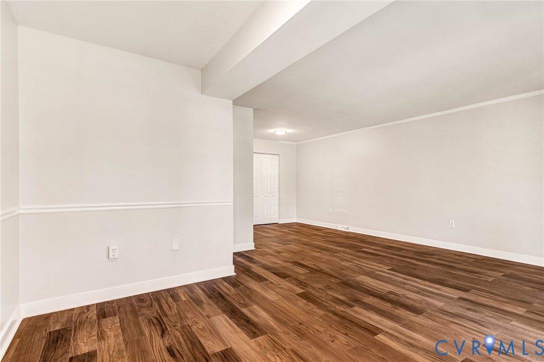 4 Millstone Road, The Hamlet, Henrico, VA 23228 Neutral interior space featuring wood-finish flooring, white walls with chair rail molding, and a double-door closet