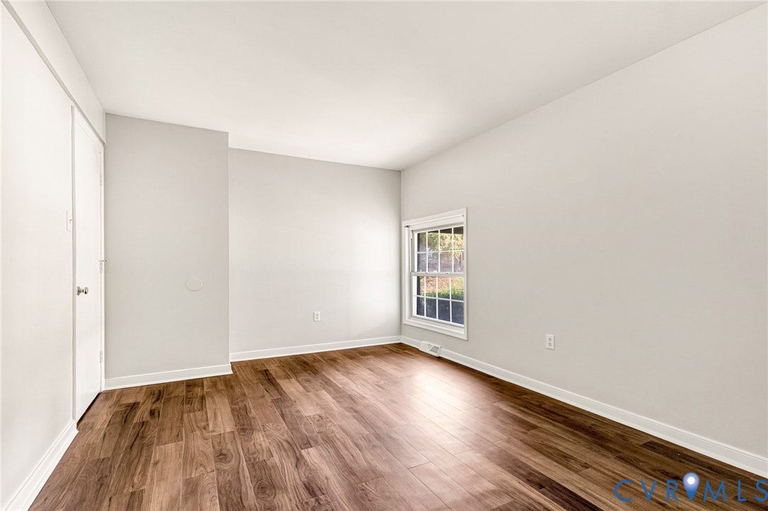 4 Millstone Road, The Hamlet, Henrico, VA 23228 Interior space featuring neutral wall paint, wood-finish flooring, and a single-hung window with a grid pattern