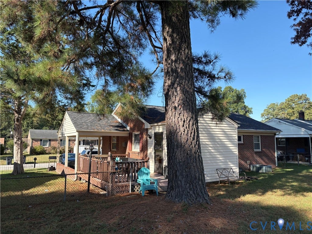 106 Verbov Avenue, Lundsford, Colonial Heights, VA 23834 Brick and vinyl siding exterior featuring a covered porch, wood-finish decking, and mature landscaping