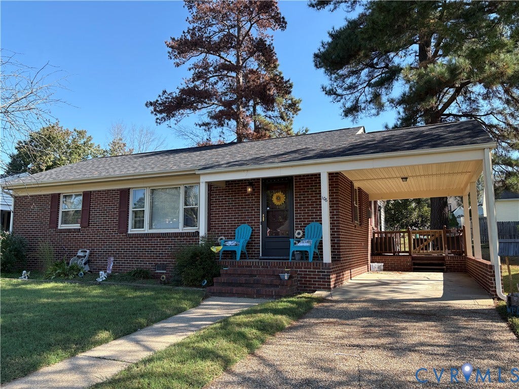 106 Verbov Avenue, Lundsford, Colonial Heights, VA 23834 Single-story brick exterior featuring a covered carport, concrete driveway, front brick steps, and rear wooden deck