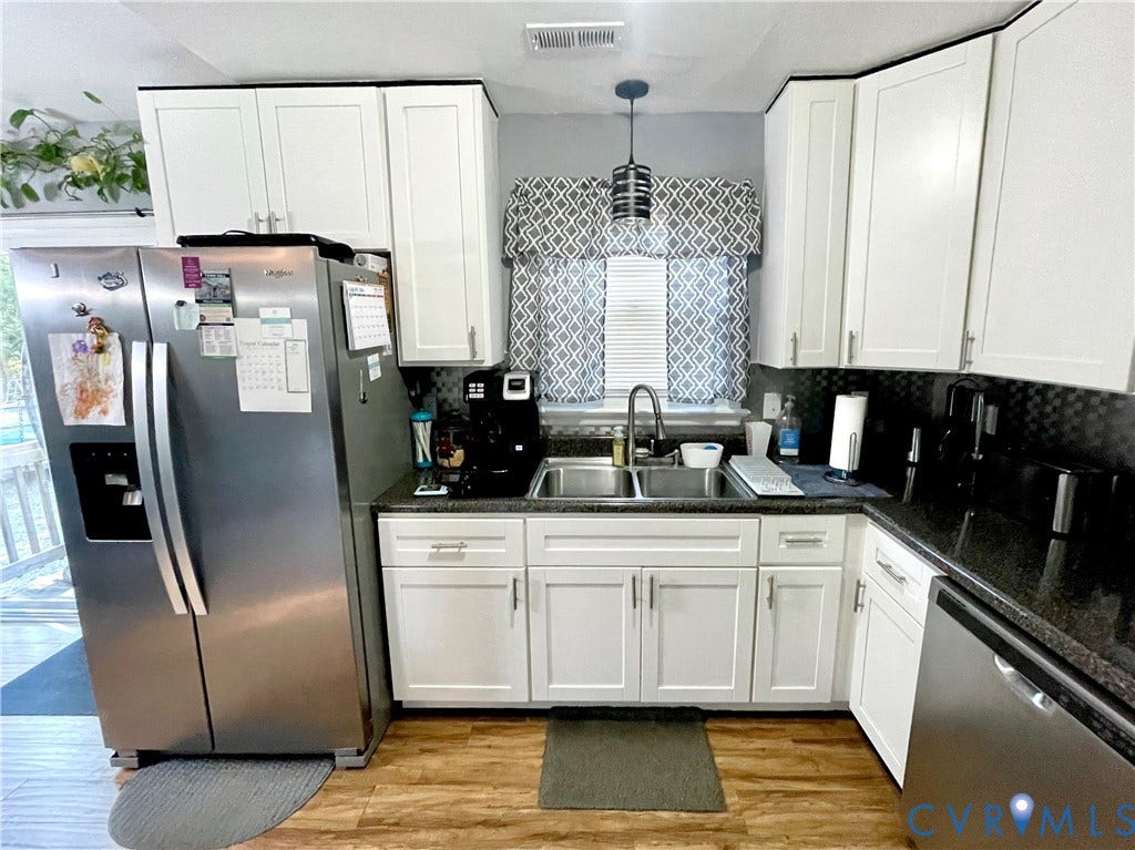 11801 New Forest Court, Chesterfield, VA 23112 Kitchen featuring white shaker-style cabinetry, dark stone-finish countertops, stainless steel appliances, a double-basin stainless steel sink, and wood-finish flooring