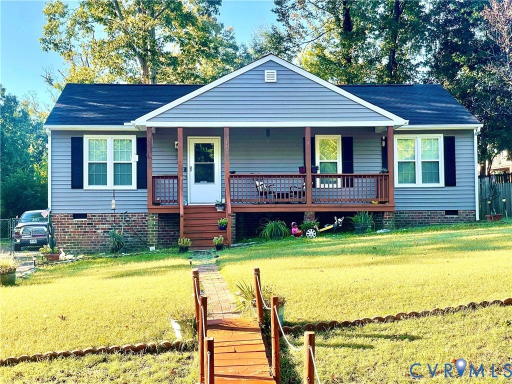 11801 New Forest Court, Chesterfield, VA 23112 Ranch-style exterior featuring grey siding, a front porch with wood railing, brick foundation detailing, and a multi-paneled front door