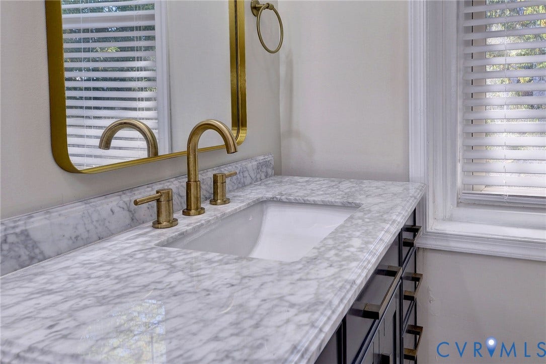 730 N 23RD Street, Union Hill, Richmond, VA 23223 Vanity featuring marble countertop.