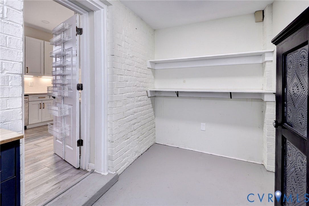 730 N 23RD Street, Union Hill, Richmond, VA 23223 Oversized pantry featuring painted brick walls. Endless storage possibilities!