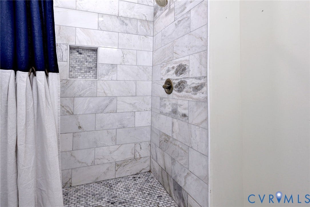 730 N 23RD Street, Union Hill, Richmond, VA 23223 Shower with coordinated tile and brass accents.