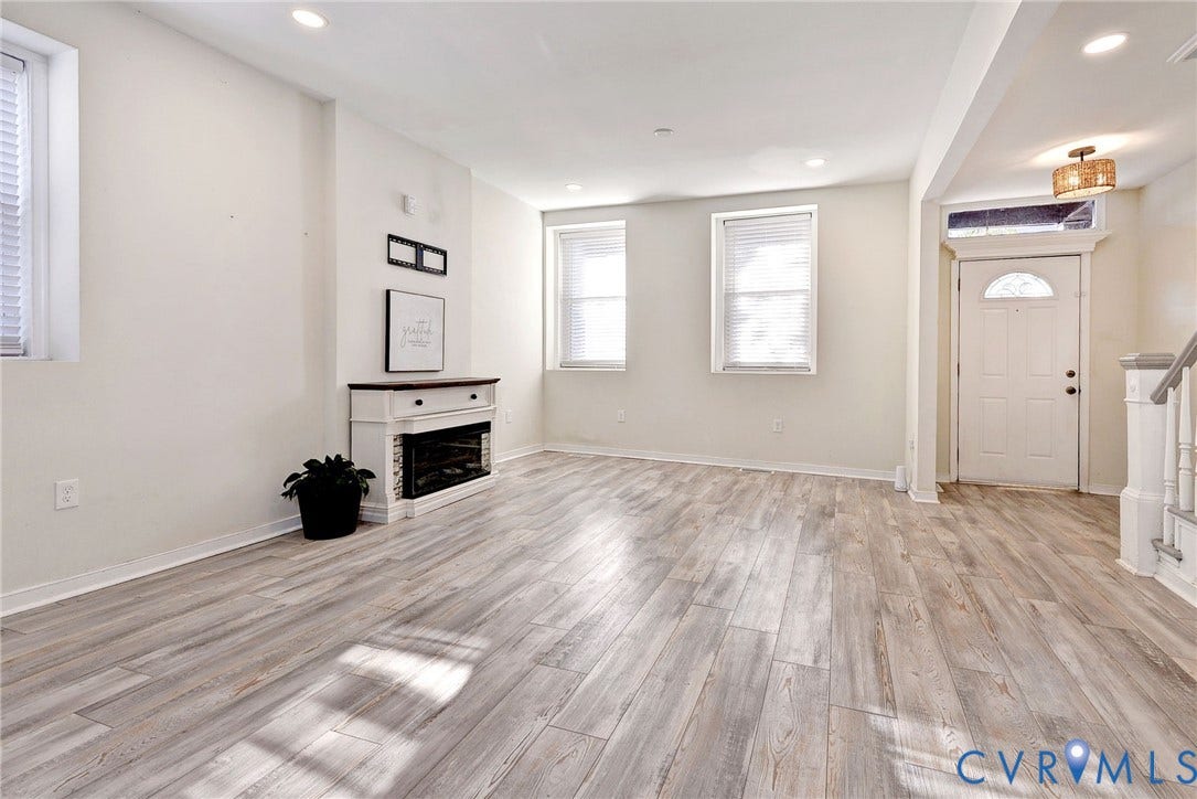 730 N 23RD Street, Union Hill, Richmond, VA 23223 Light filled living space featuring recessed lighting and electric fireplace.