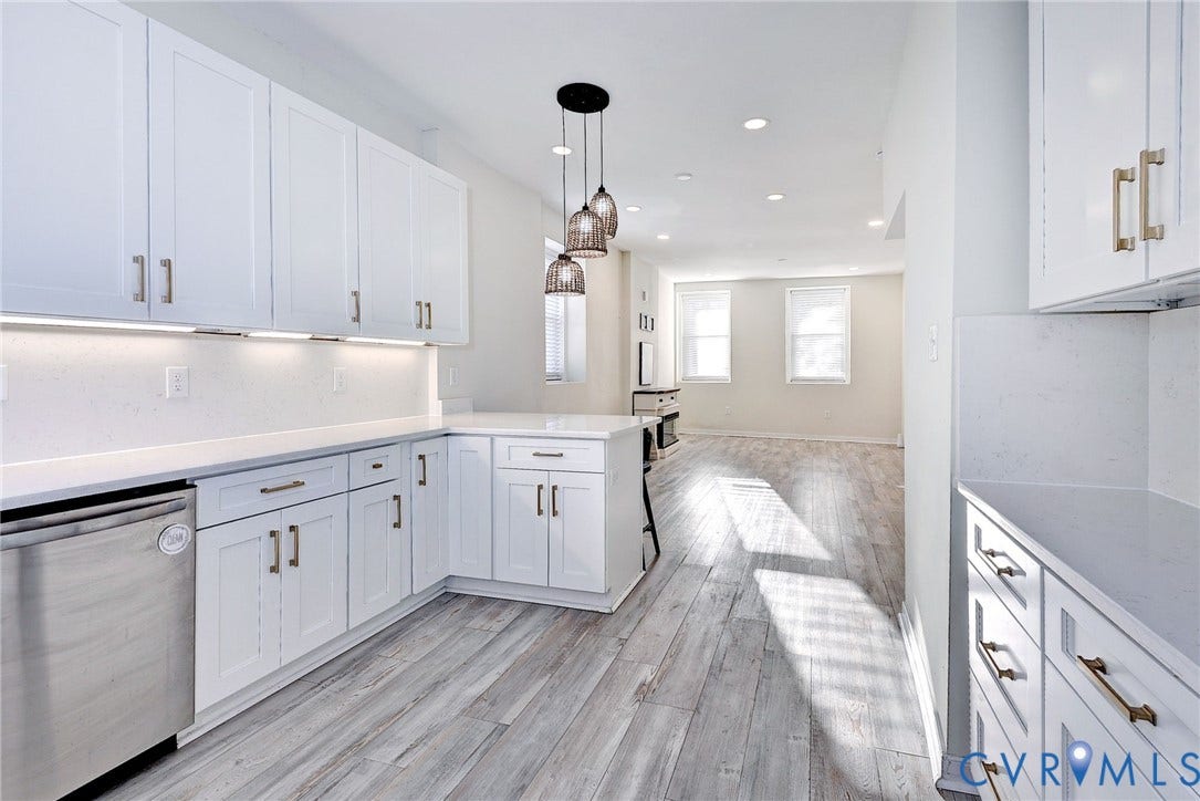 730 N 23RD Street, Union Hill, Richmond, VA 23223 Kitchen featuring white shaker-style cabinetry, quartz countertops, stainless steel appliances, and both pendant and recessed lighting.