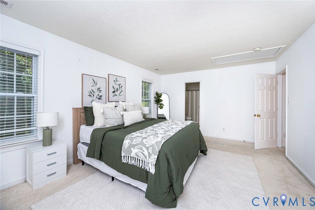 2408 Swartwout Avenue, Woodland Hills, Henrico, VA 23228 Neutral-toned bedroom featuring carpeted flooring, dual-pane windows with horizontal blinds, and a six-panel interior door