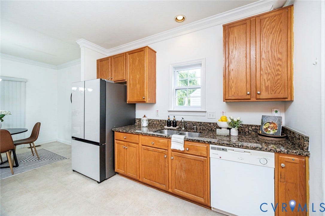 2408 Swartwout Avenue, Woodland Hills, Henrico, VA 23228 Kitchen featuring wood cabinetry, stone-surface countertops, dual-basin stainless steel sink, and crown molding