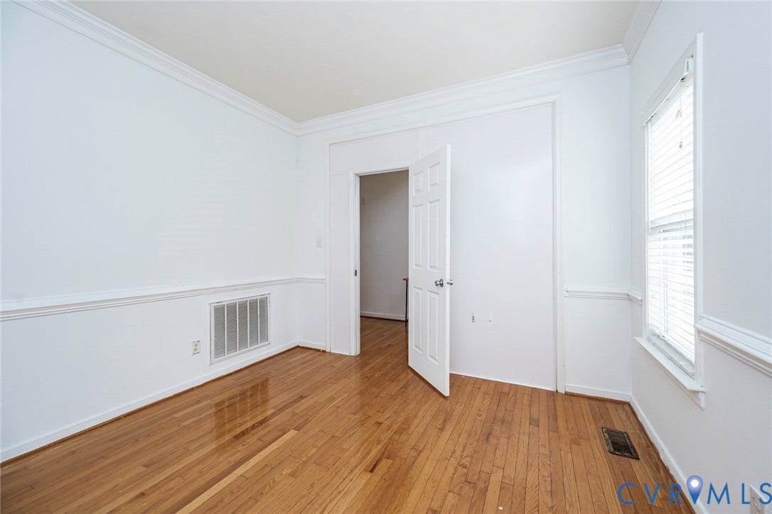 2408 Swartwout Avenue, Woodland Hills, Henrico, VA 23228 Interior room featuring wood-finish flooring, white crown molding, chair rail trim, and a multi-pane window