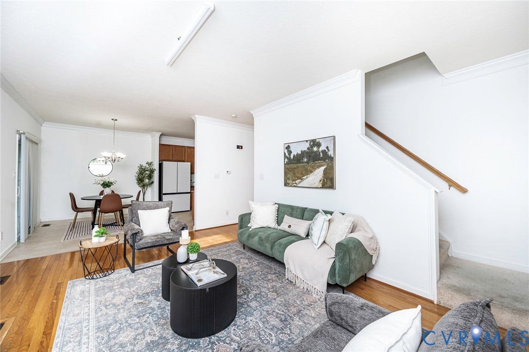2408 Swartwout Avenue, Woodland Hills, Henrico, VA 23228 Open-concept interior featuring wood-finish flooring, crown molding, a staircase with a wooden handrail, and integrated ceiling lighting