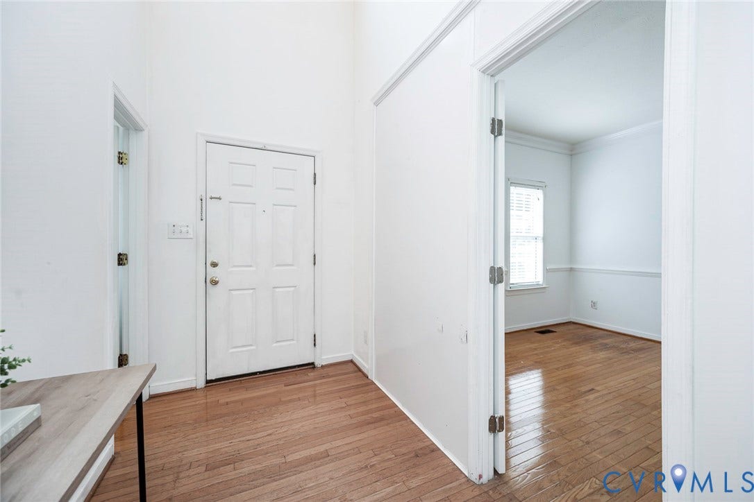 2408 Swartwout Avenue, Woodland Hills, Henrico, VA 23228 Entryway featuring high ceilings, wood-finish flooring, and a paneled front door