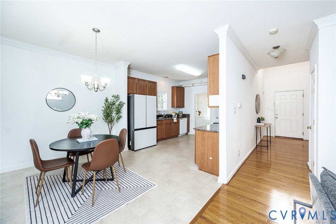 2408 Swartwout Avenue, Woodland Hills, Henrico, VA 23228 Kitchen featuring wood cabinetry, stone-finish countertops, and built-in appliances, complemented by a dining area with crown molding, wood-finish flooring, and a multi-arm chandelier